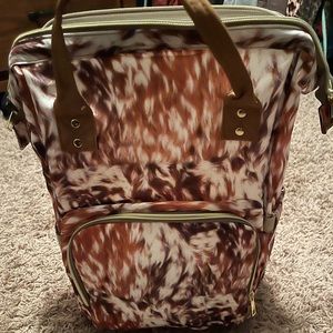 Brownish vinyl cowhide diaper bag never used